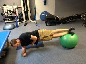 Side planks with exercise ball