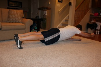 Plank with arm lift