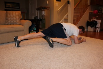 Plank with knee to elbow motion