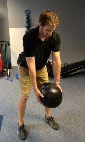 Setup for the medicine ball golf swing exercise